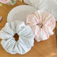 Close-up of Gifty striped scrunchie showing fabric texture and stripe pattern