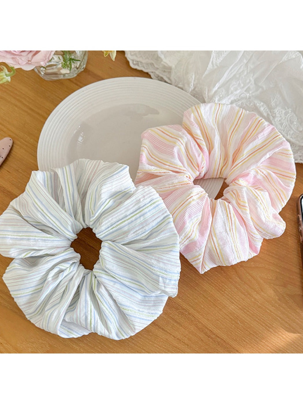 Close-up of Gifty striped scrunchie showing fabric texture and stripe pattern