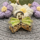 Beau hair clip displayed on white background showing full bow design