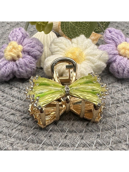Beau hair clip displayed on white background showing full bow design