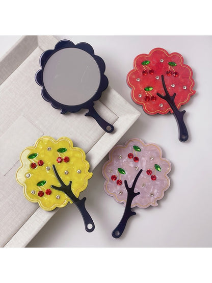 Mirroray handheld mirror with a stylish tree-shaped frame on a white background