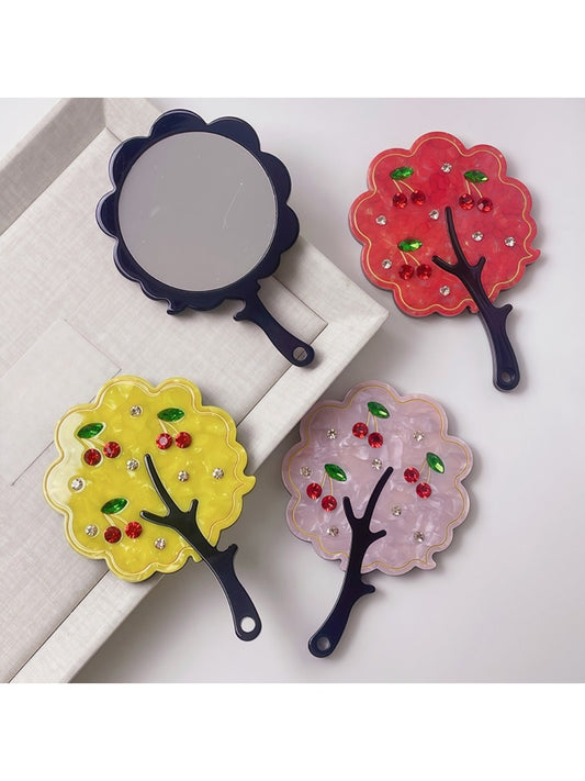 Mirroray handheld mirror with a stylish tree-shaped frame on a white background