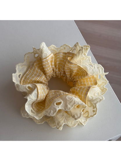 Model wearing Gifty lace scrunchie in hair, showcasing its comfortable fit and stylish look
