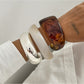 Side view of Lovra asymmetrical bangle bracelet highlighting unique design