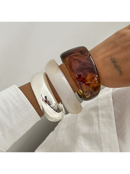 Side view of Lovra asymmetrical bangle bracelet highlighting unique design