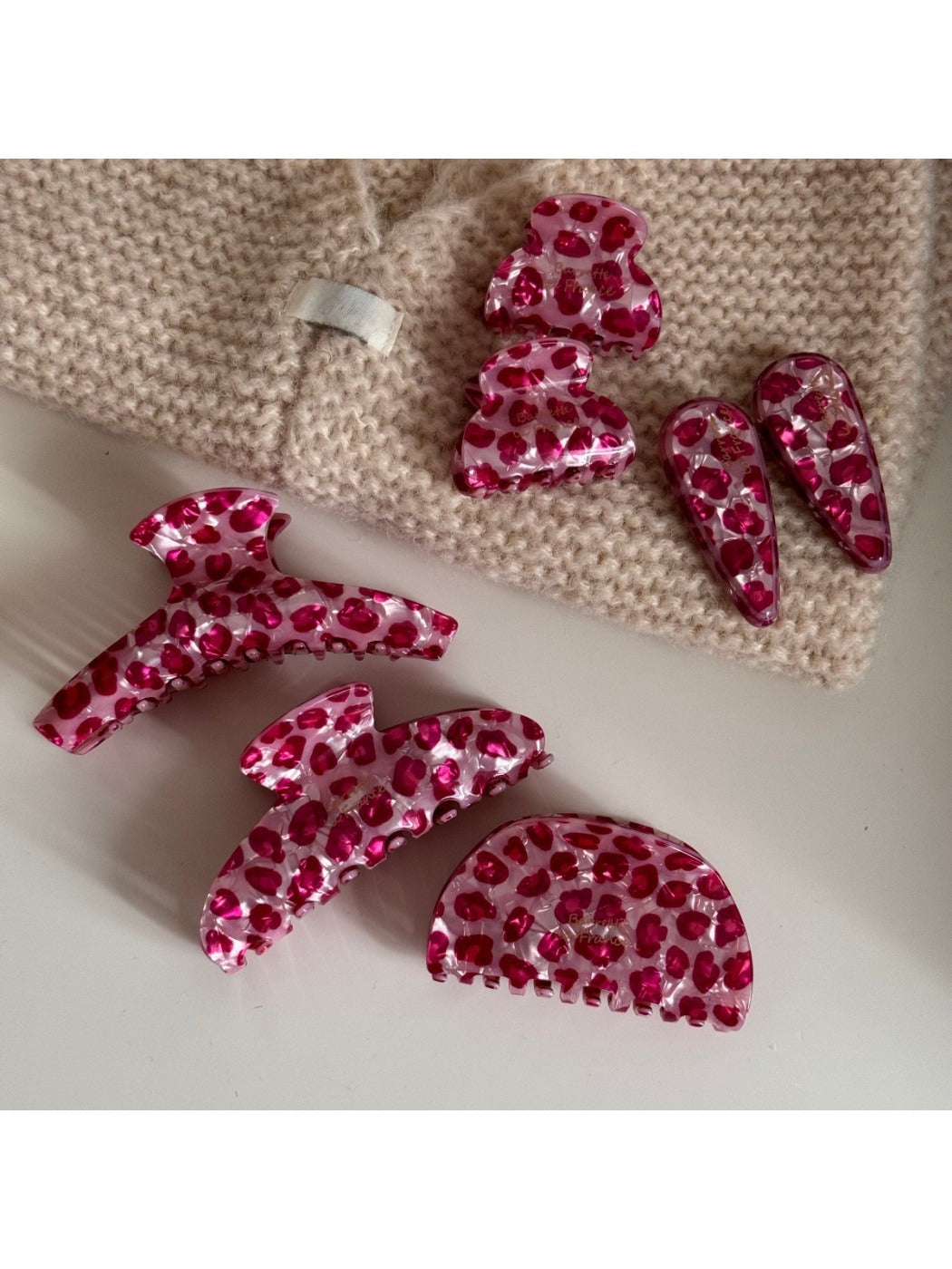 Side view of Beau pink leopard print acetate hair clip highlighting clasp mechanism