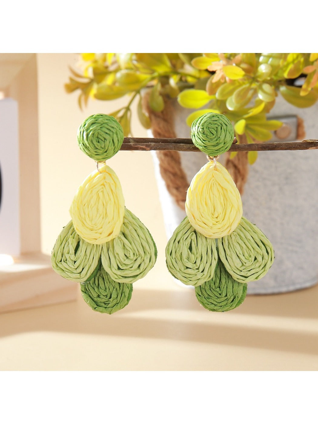Top view of Earedge color block raffia drop earrings showing oval shape and woven details