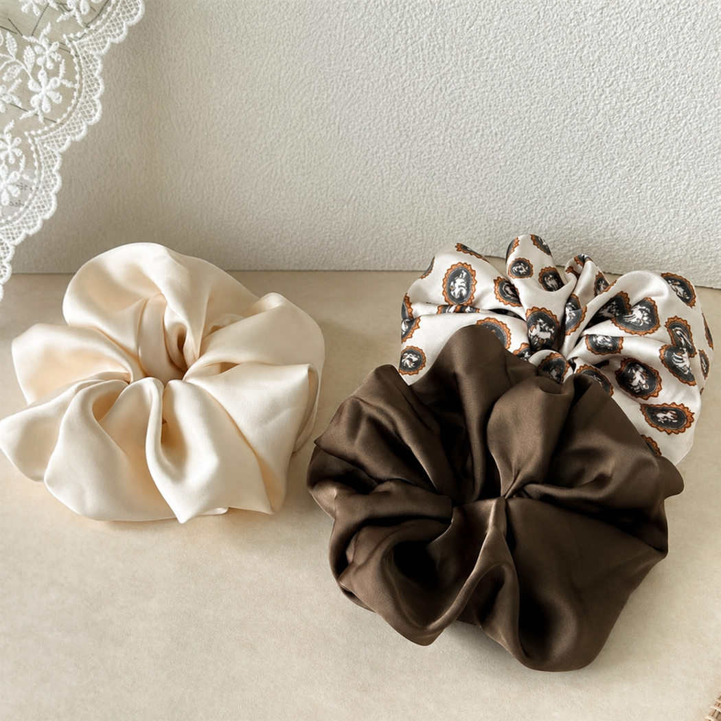 Oversized glossy scrunchies in ivory, brown and leopard pattern