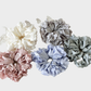 Gifty - Lace Petal Glossy Scrunchie variant overview on neutral background