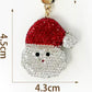 Red Santa face keychain with 4.5 by 4.3 cm dimensions