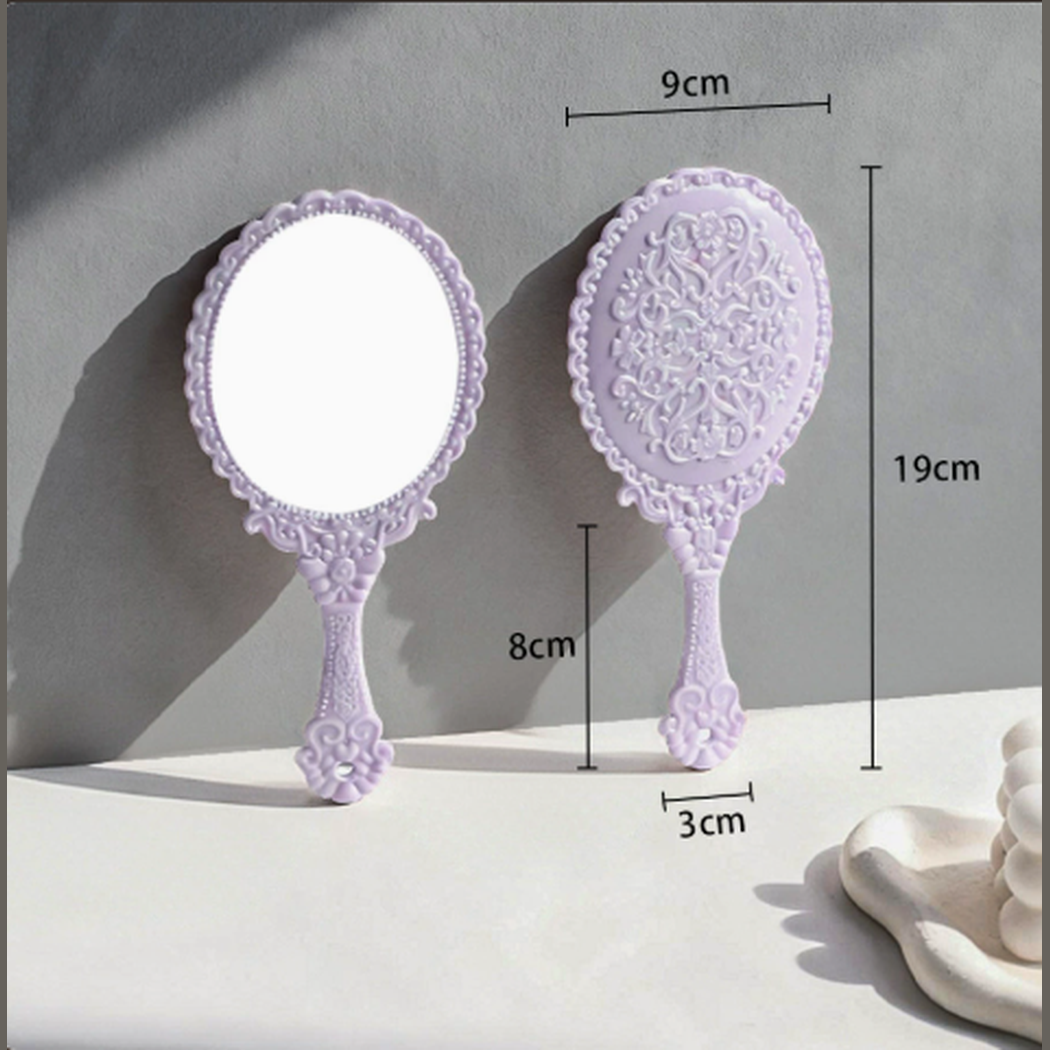 Ornate oval hand mirror dimensions: 9 × 19 cm; handle 8 cm long and 3 cm wide
