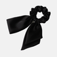 Black Gifty - Glossy Bow Scrunchie on neutral background
