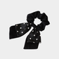 DotBowBlk Gifty - Layered Polka Dot Bow Scrunchie on neutral background