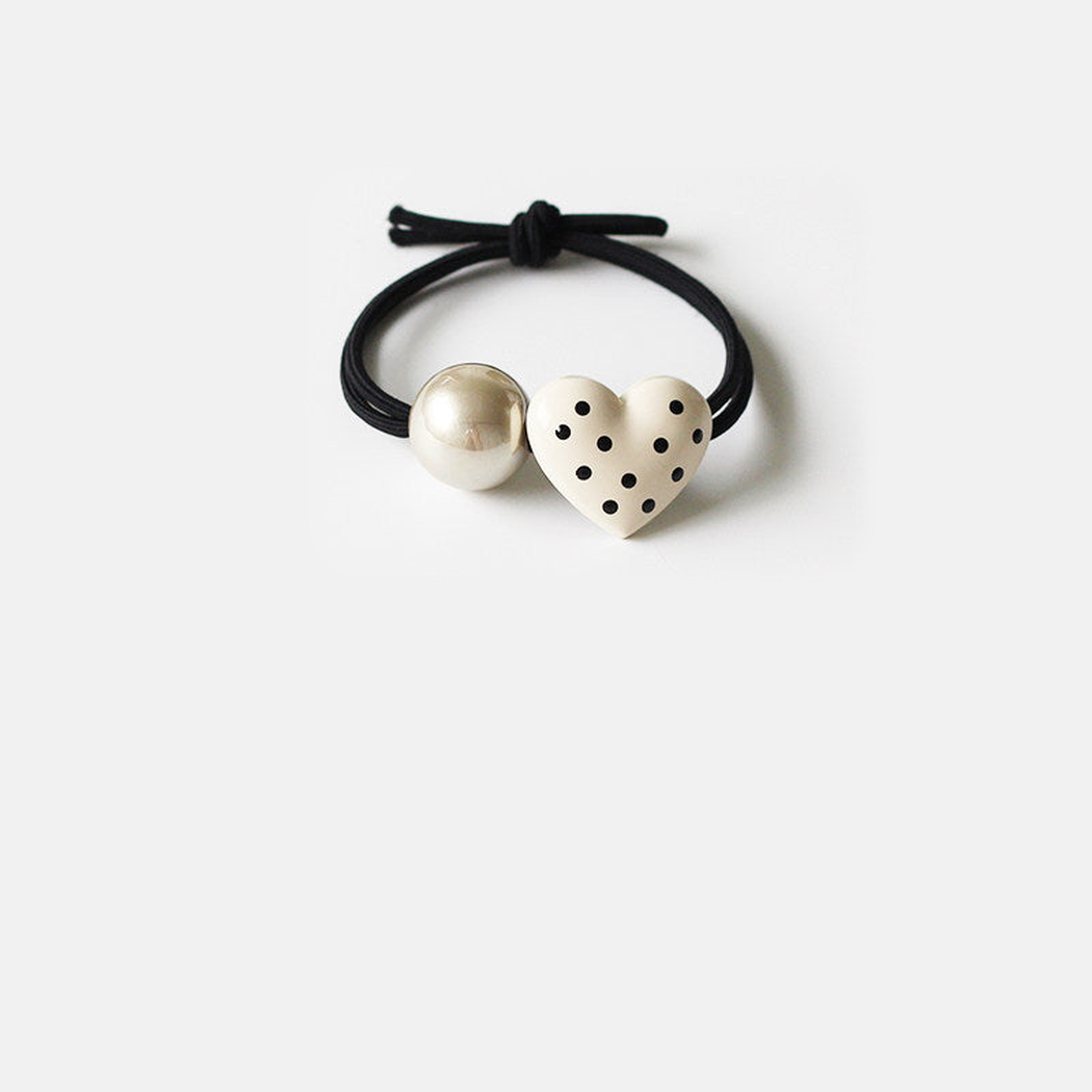 White Gifty - Heart Bead Hair Tie on neutral background