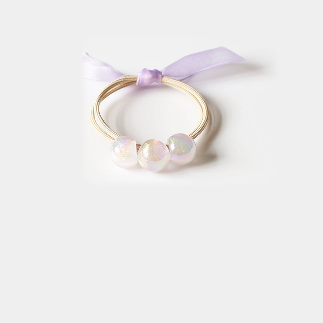 Purple Gifty - Iridescent Bead Hair Tie on neutral background