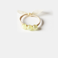 Yellow Gifty - Iridescent Bead Hair Tie on neutral background