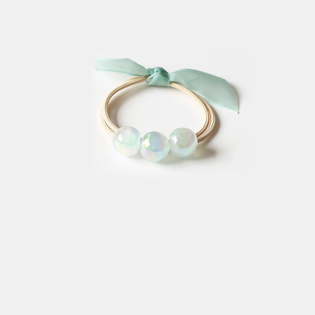 Teal Gifty - Iridescent Bead Hair Tie on neutral background