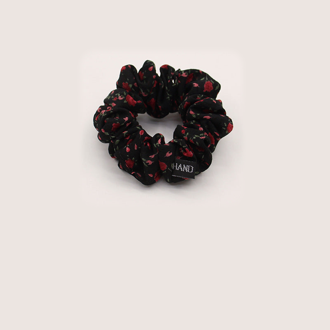 Black Gifty - Gathered Floral Scrunchie on neutral background