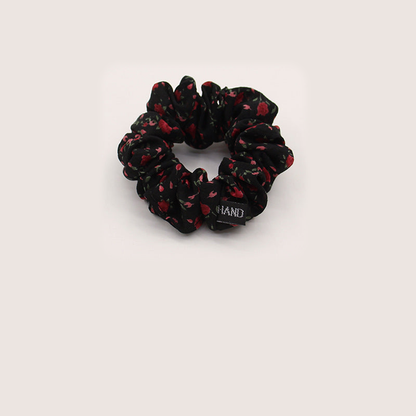 Black Gifty - Gathered Floral Scrunchie on neutral background