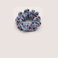 Blue Gifty - Gathered Floral Scrunchie on neutral background