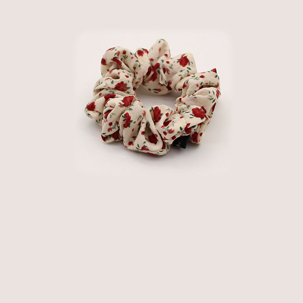 White Gifty - Gathered Floral Scrunchie on neutral background