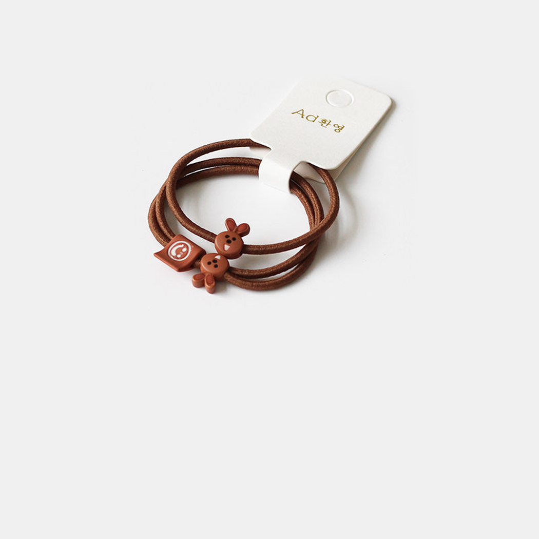 Brown Gifty - Bunny Charm Hair Tie on neutral background