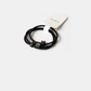 Black Gifty - Bunny Charm Hair Tie on neutral background