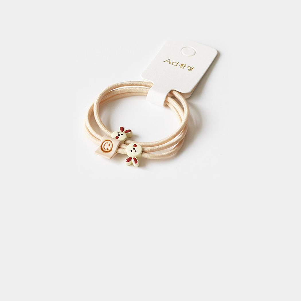 Khaki Gifty - Bunny Charm Hair Tie on neutral background
