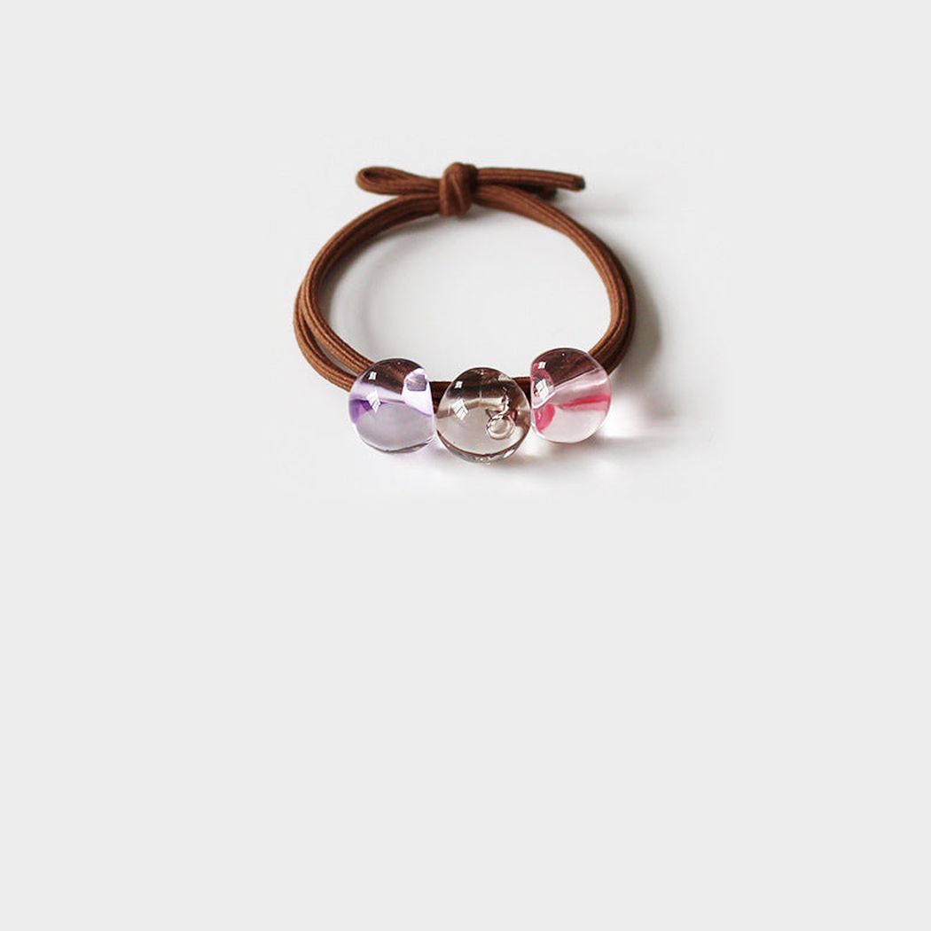 GrayPurple Gifty - Blended Color Bead Hair Tie on neutral background