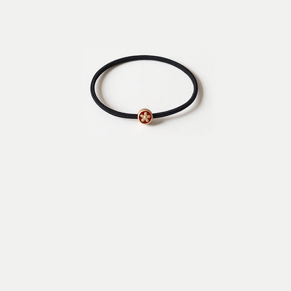 SmallFlwr Gifty - Fish Flower Charm Hair Tie on neutral background