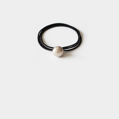 Black Gifty - Round Pearl Bead Hair Tie on neutral background