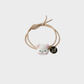 BearWhite Gifty - Dog Bear Charm Hair Tie on neutral background