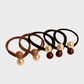 Black Gifty - Round Elastic Hair Tie on neutral background