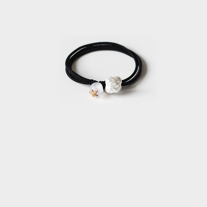 White Gifty - Round Bead Hair Tie on neutral background