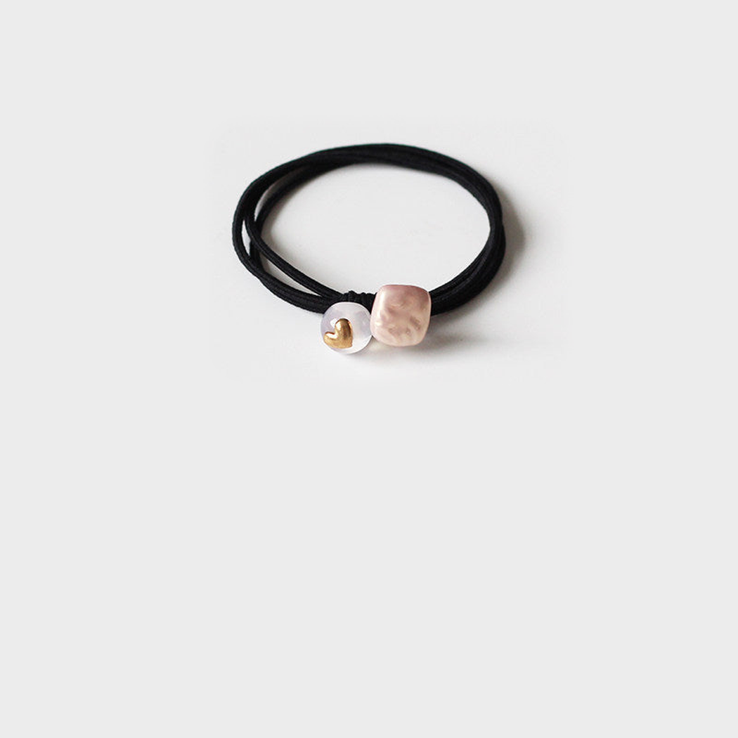 Pink Gifty - Round Bead Hair Tie on neutral background