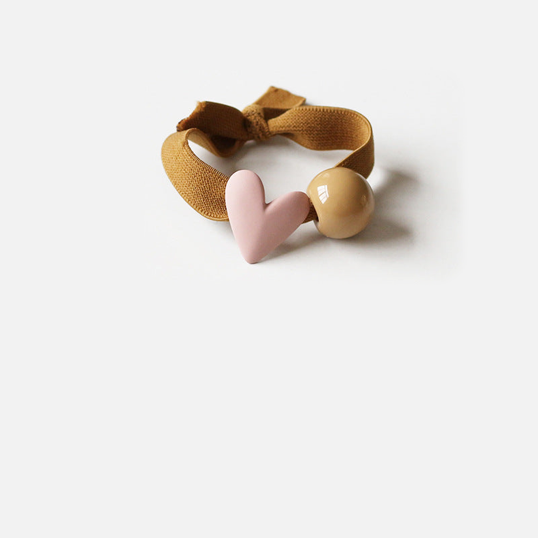 Khaki Gifty - Bead Charm Hair Tie on neutral background