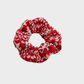 Red Gifty - Christmas Plush Scrunchie on neutral background