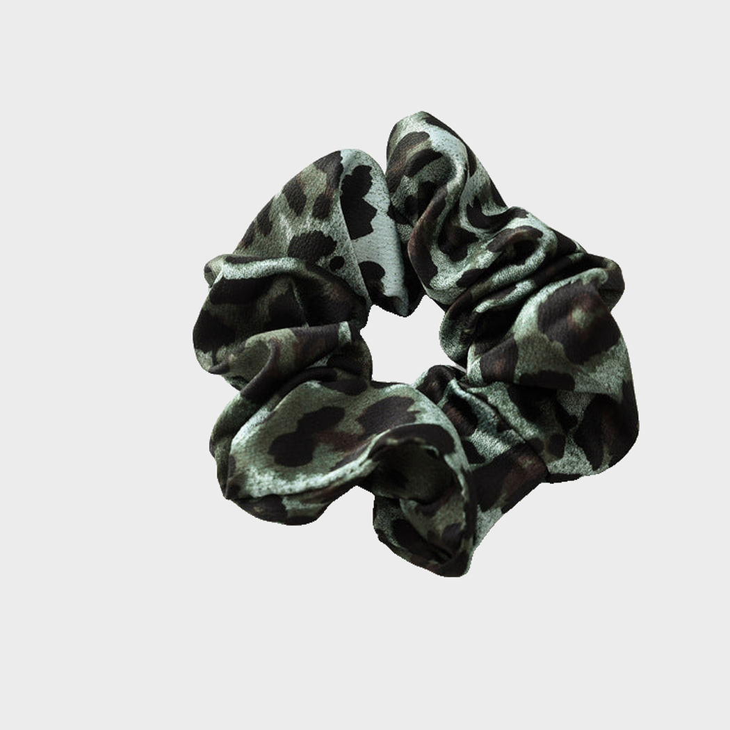 LeoDkGreen Gifty - Leopard Glossy Scrunchie on neutral background