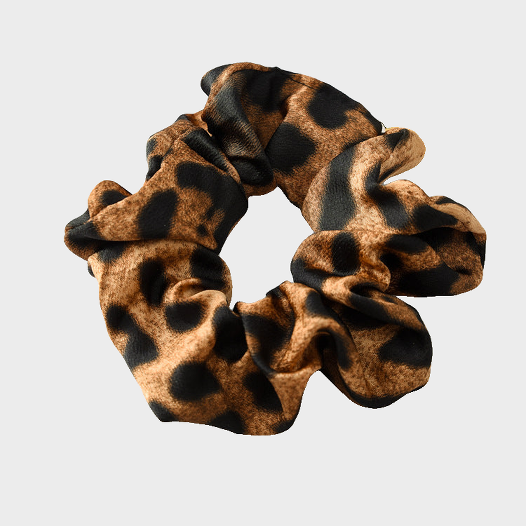 LeoDkBrown Gifty - Leopard Glossy Scrunchie on neutral background