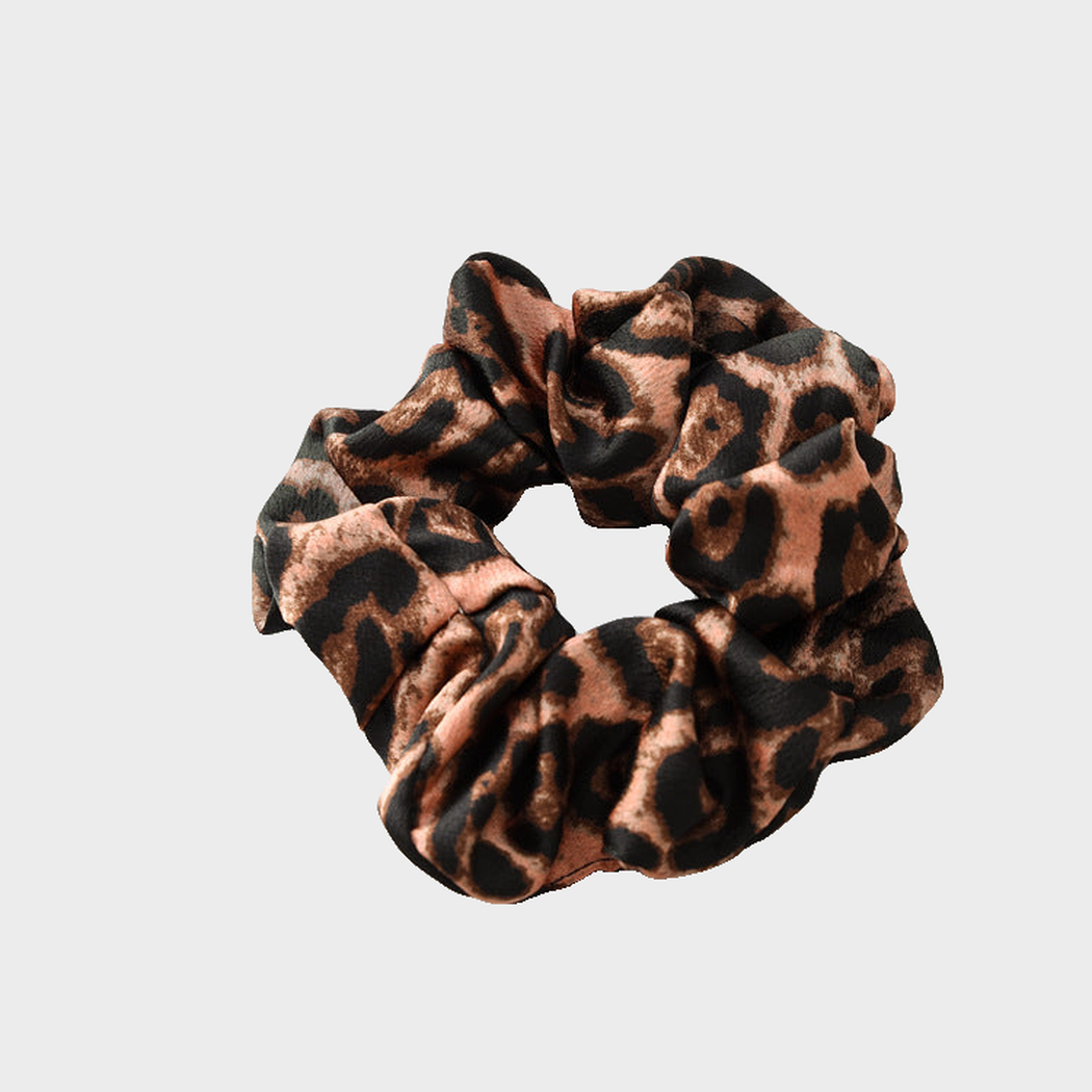 LeoBrown Gifty - Leopard Glossy Scrunchie on neutral background
