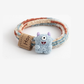 MonsBlue Gifty - Monster Label Hair Tie on neutral background