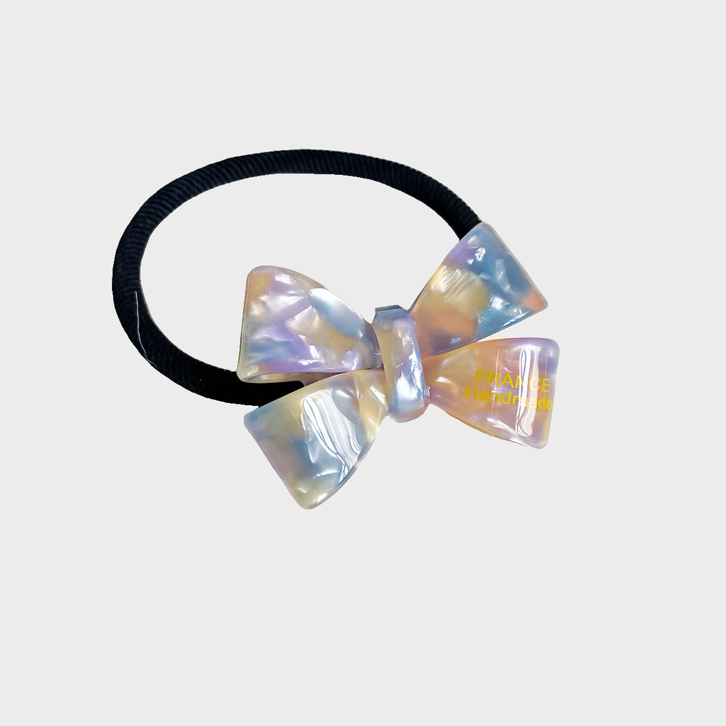 IridPurp Gifty - Iridescent Bow Hair Tie on neutral background