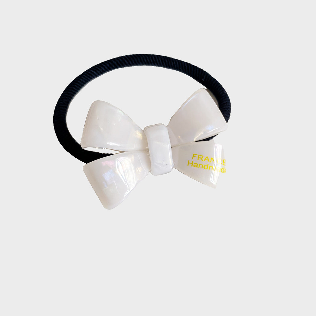 Mermaid Gifty - Iridescent Bow Hair Tie on neutral background