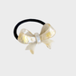 IridYlw Gifty - Iridescent Bow Hair Tie on neutral background