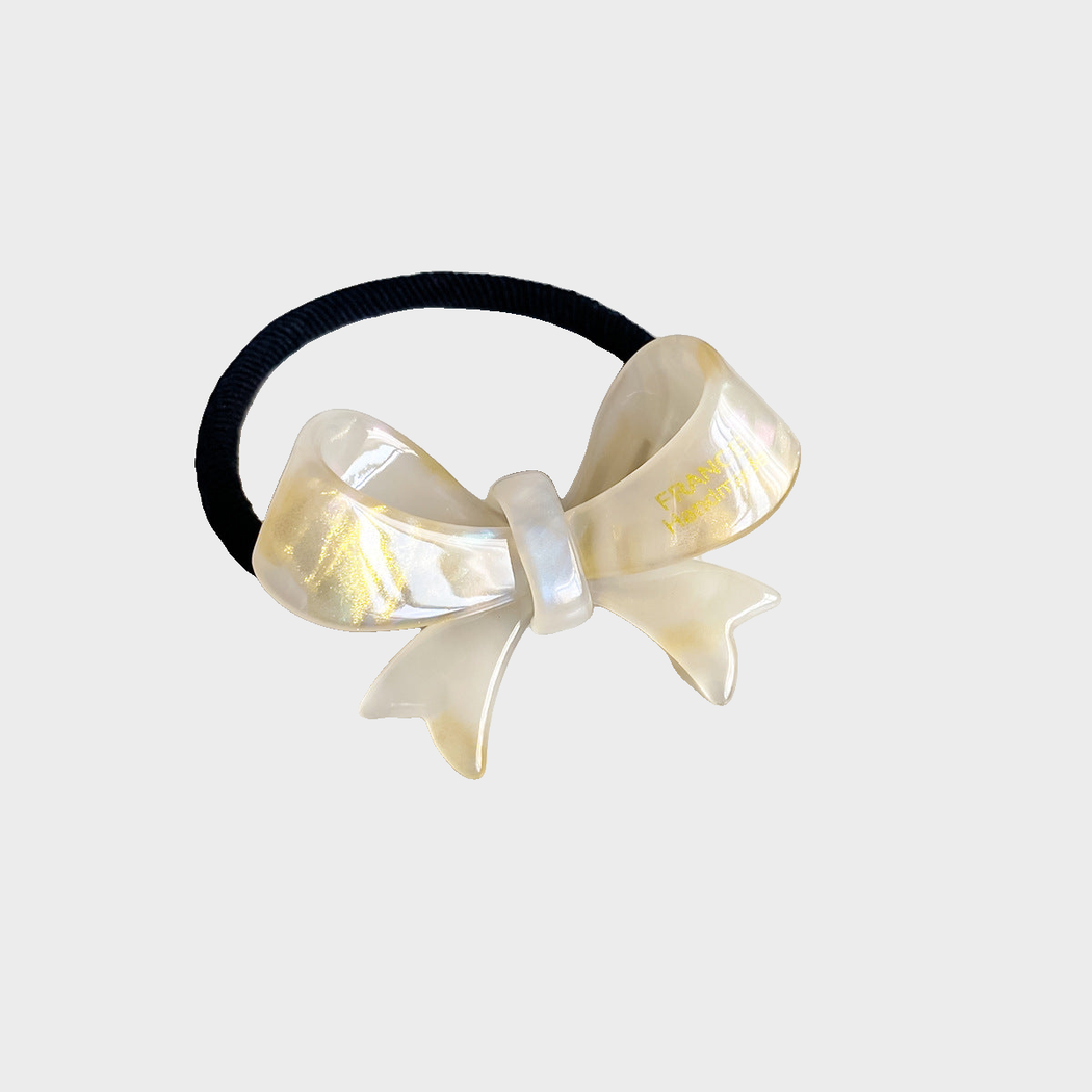 IridYlw Gifty - Iridescent Bow Hair Tie on neutral background