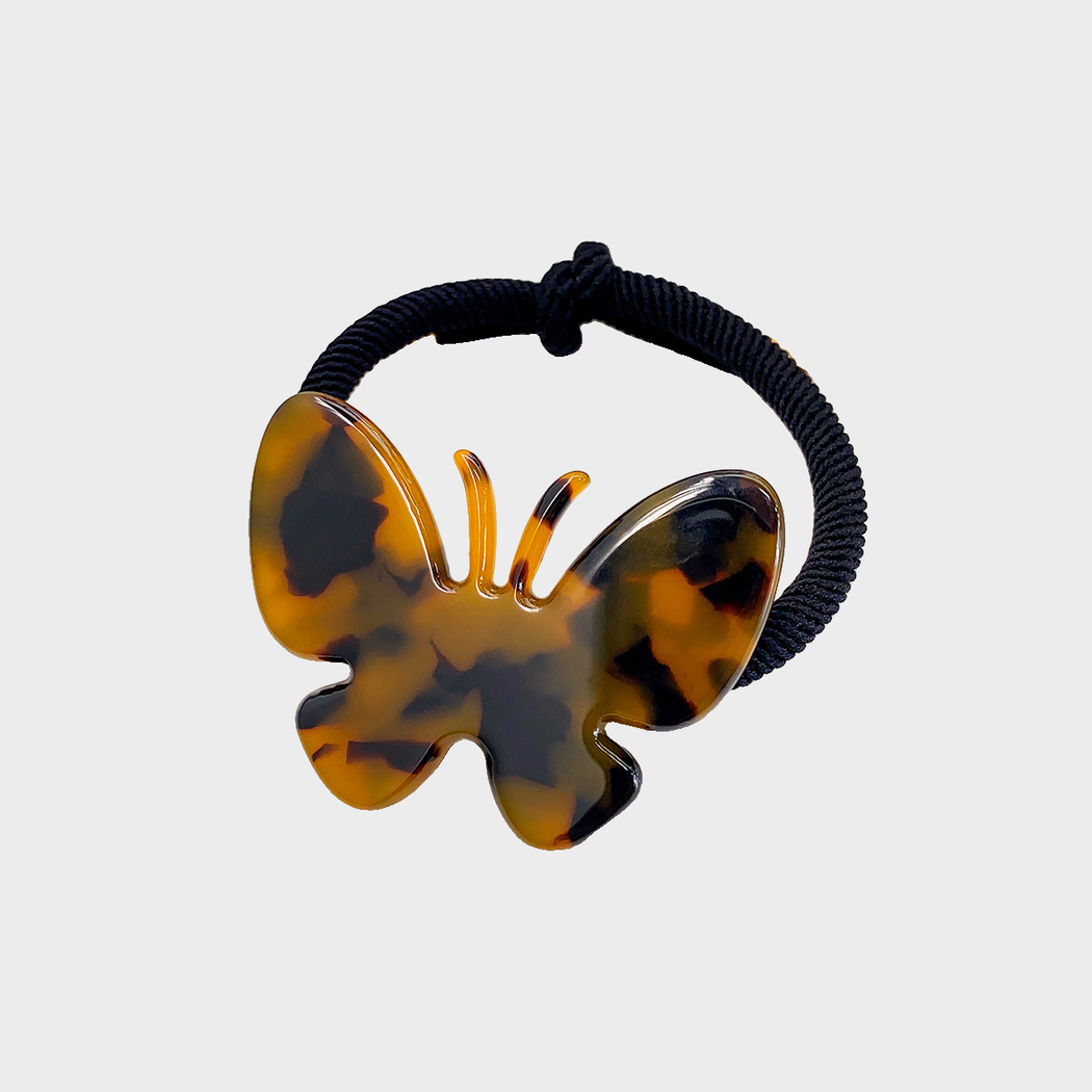 TortBrown Gifty - Butterfly Charm Hair Tie on neutral background