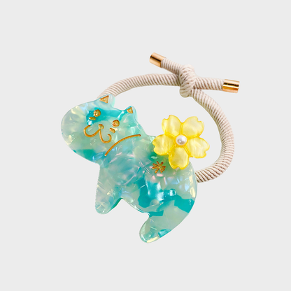 Iridescent Gifty - Marbled Cat Hair Tie on neutral background