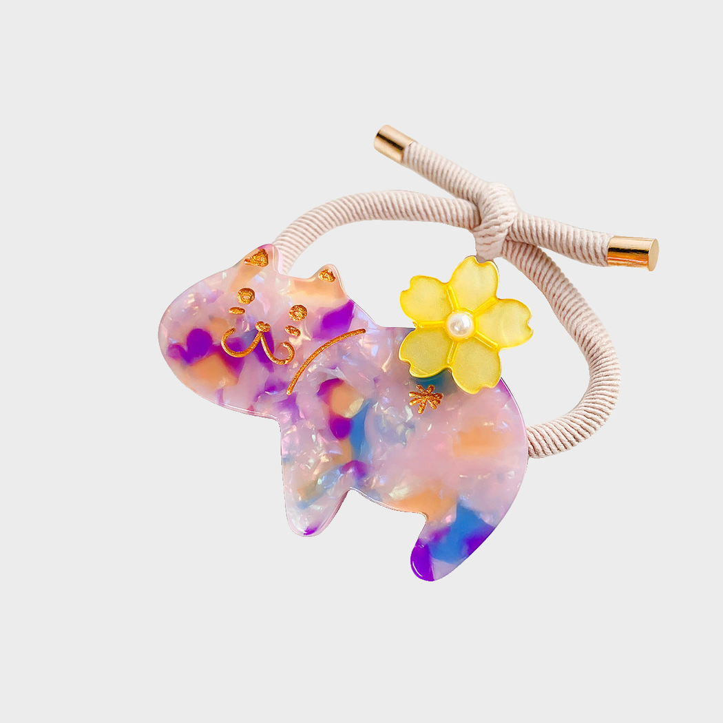 Speckle Gifty - Marbled Cat Hair Tie on neutral background