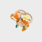 Orange Gifty - Marbled Cat Hair Tie on neutral background