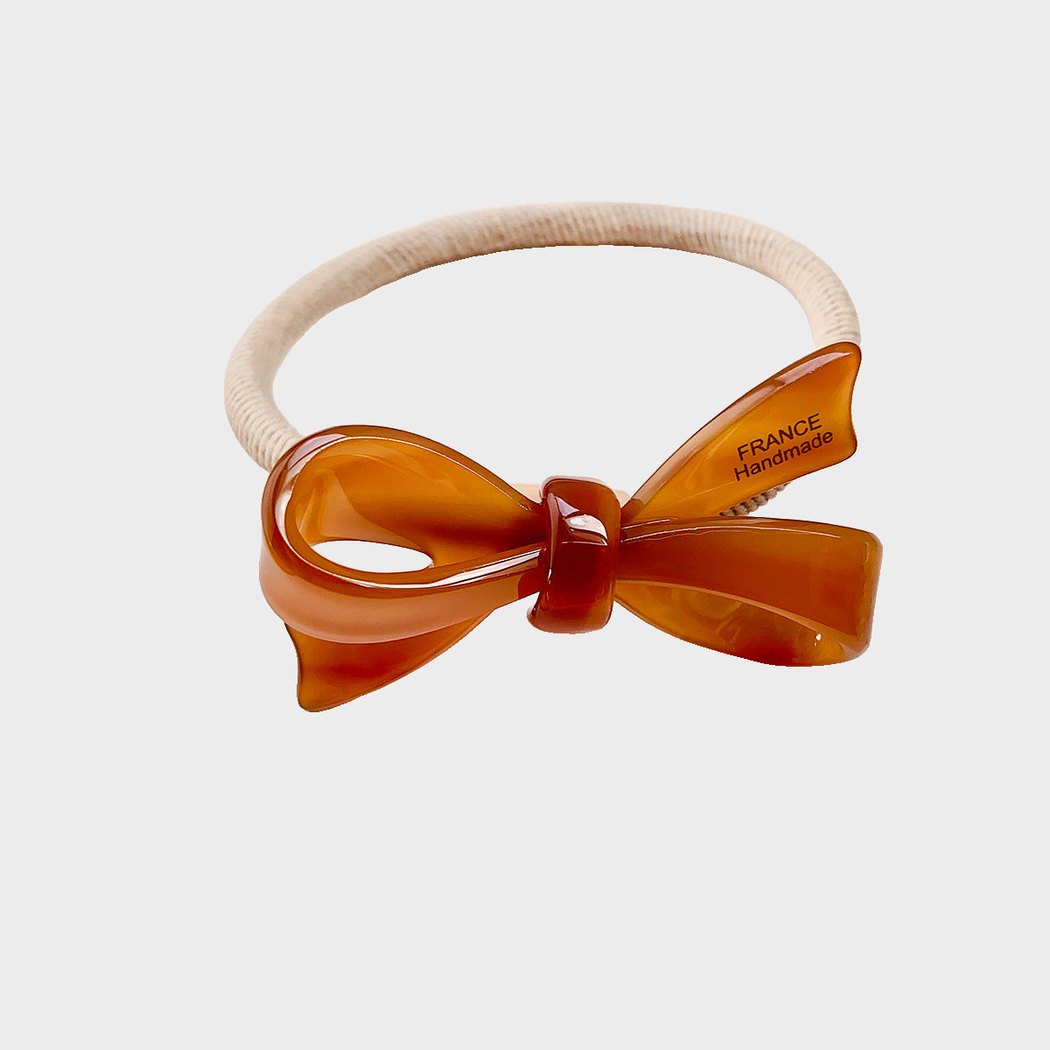 Caramel Gifty - 3D Bow Hair Tie on neutral background